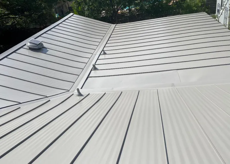 Solar attic fan installed on a metal roof for Roof Ventilation in Berkeley